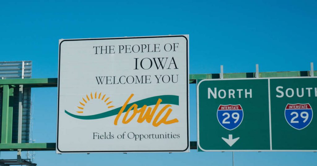 Iowa welcome sign on a highway.