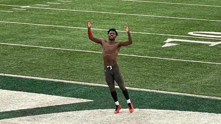 Antonio Brown runs around shirtless in the Jets' endzone mid-game.